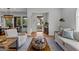 Cozy living room features neutral tones, hardwood floors and a decorative coffee table at 185 Central Ave, Fayetteville, GA 30214