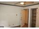 Bedroom features a ceiling fan and open closet with shelves at 8469 Shiloh Ct, Jonesboro, GA 30238