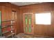Cozy bedroom with wood paneling and laminate flooring at 8469 Shiloh Ct, Jonesboro, GA 30238