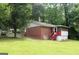 Back exterior of brick home with screened-in porch at 8469 Shiloh Ct, Jonesboro, GA 30238