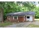 Exterior view of brick home with chain-link fence in front at 8469 Shiloh Ct, Jonesboro, GA 30238