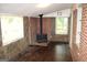 Living room with a wood burning stove at 8469 Shiloh Ct, Jonesboro, GA 30238
