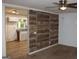 Spacious living room featuring a wood plank wall and neutral color palette at 8469 Shiloh Ct, Jonesboro, GA 30238