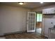 Room features wood look flooring, door to porch and cabinet with sink at 8469 Shiloh Ct, Jonesboro, GA 30238