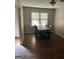 Dining room featuring wood floors, a window, and a wooden table with chairs at 1810 Highway 138 E, Stockbridge, GA 30281