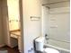 Bright bathroom featuring a tub and shower combination, toilet, and vanity with ample storage at 4196 Lehigh Blvd, Decatur, GA 30034