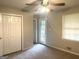 Standard bedroom with neutral carpet and a ceiling fan at 4196 Lehigh Blvd, Decatur, GA 30034