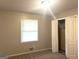 Bedroom with neutral carpet, a window with blinds, and a closet at 4196 Lehigh Blvd, Decatur, GA 30034