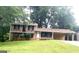 Two-story brick home with a covered carport and a well-maintained front lawn at 4196 Lehigh Blvd, Decatur, GA 30034
