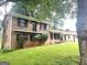 Angle view of a two-story brick home with a covered carport and a green lawn at 4196 Lehigh Blvd, Decatur, GA 30034