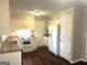 Traditional kitchen with white appliances, cabinets, and laminate countertops at 4196 Lehigh Blvd, Decatur, GA 30034