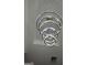 Close up of modern circular chandelier with crystal and brass accents at 1293 E M Croy Rd, Sugar Hill, GA 30518