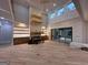 Bright living room with hardwood floors, custom shelving, and modern recessed lighting at 1293 E M Croy Rd, Sugar Hill, GA 30518