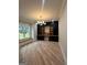 Stylish home office features custom built-ins, hardwood floors, and a large window at 1293 E M Croy Rd, Sugar Hill, GA 30518