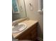 Bathroom featuring a single sink vanity with a mirror, paired with a clean and simple design at 2074 Ayers Creek Ct, Villa Rica, GA 30180