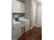 Laundry room featuring white washer, dryer and cabinets at 2074 Ayers Creek Ct, Villa Rica, GA 30180