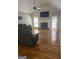 Spacious living room with a fireplace, hardwood floors, and ample natural light at 2074 Ayers Creek Ct, Villa Rica, GA 30180