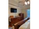 This bedroom features a ceiling fan, a TV, and a spacious layout with hardwood floors at 2074 Ayers Creek Ct, Villa Rica, GA 30180