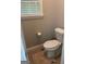 Bathroom featuring a toilet, floor mat and window at 2074 Ayers Creek Ct, Villa Rica, GA 30180