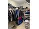 Walk-in closet with ample hanging space and shelving for efficient clothing and accessory storage at 2074 Ayers Creek Ct, Villa Rica, GA 30180