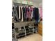 Spacious walk-in closet with well-organized shelves and rods for optimal storage of clothing, shoes, and accessories at 2074 Ayers Creek Ct, Villa Rica, GA 30180