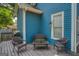 Cozy outdoor seating arrangement on a back porch with a grill, perfect for summer evenings and entertaining at 638 Mcgruder Ne St, Atlanta, GA 30312