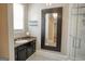 Elegant bathroom featuring granite counters, shower, and stylish black and white mosaic tile flooring throughout at 638 Mcgruder Ne St, Atlanta, GA 30312