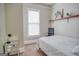 Bedroom with a white bed, chair, and a view from the window at 638 Mcgruder Ne St, Atlanta, GA 30312