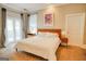 Comfortable bedroom with carpet, access to patio, a ceiling fan, and a bed with white comforter at 638 Mcgruder Ne St, Atlanta, GA 30312