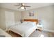 Neutral bedroom featuring a ceiling fan, natural light, and calming artwork creates a serene space for relaxation at 638 Mcgruder Ne St, Atlanta, GA 30312