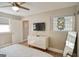 Bright, spacious bedroom featuring neutral walls, a ceiling fan, and a stained glass window at 638 Mcgruder Ne St, Atlanta, GA 30312
