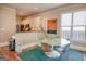 Cozy dining area featuring a glass table, colorful chairs, and a modern artistic painting at 638 Mcgruder Ne St, Atlanta, GA 30312