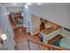 Open-concept living featuring hardwood floors, a staircase, and views of the kitchen and living areas at 638 Mcgruder Ne St, Atlanta, GA 30312