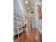 Bright foyer features hardwood floors, a staircase, and natural light from skylights at 638 Mcgruder Ne St, Atlanta, GA 30312