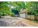 Exterior view of the garage with a white garage door and a gravel driveway at 638 Mcgruder Ne St, Atlanta, GA 30312