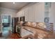Modern kitchen featuring stainless steel appliances, granite counters, and white cabinetry at 638 Mcgruder Ne St, Atlanta, GA 30312