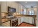 Stylish kitchen featuring granite countertops, stainless steel appliances, and ample white cabinetry at 638 Mcgruder Ne St, Atlanta, GA 30312