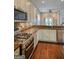 The kitchen is complete with stainless steel appliances, custom cabinetry, and tile backsplash at 638 Mcgruder Ne St, Atlanta, GA 30312