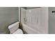 Clean bathroom with a white shower and bathtub combination at 3507 Hideaway Ln, Loganville, GA 30052