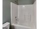 Clean bathroom with a white shower and bathtub combination at 3507 Hideaway Ln, Loganville, GA 30052