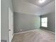Bedroom with neutral carpet, window and vaulted ceiling at 3507 Hideaway Ln, Loganville, GA 30052