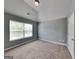 Bedroom with neutral carpet and a window at 3507 Hideaway Ln, Loganville, GA 30052