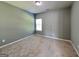 Bedroom with neutral carpet and a window at 3507 Hideaway Ln, Loganville, GA 30052
