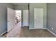 This bedroom features neutral carpeting and paint with white doors and trim at 3507 Hideaway Ln, Loganville, GA 30052