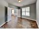 Living room featuring hardwood flooring, with connecting rooms at 3507 Hideaway Ln, Loganville, GA 30052