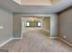 Expansive main bedroom with tray ceiling, neutral carpeting, and lots of natural light at 3507 Hideaway Ln, Loganville, GA 30052