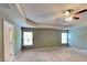 Spacious main bedroom featuring two windows and a ceiling fan at 3507 Hideaway Ln, Loganville, GA 30052