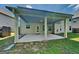 Covered patio with concrete floor and white columns at 3507 Hideaway Ln, Loganville, GA 30052