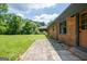 Exterior brick home with a beautiful walkway and luscious green grass at 3219 W Manor Ln, Atlanta, GA 30311