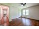 Bedroom featuring hardwood floors, closet, ceiling fan, and natural light at 3219 W Manor Ln, Atlanta, GA 30311